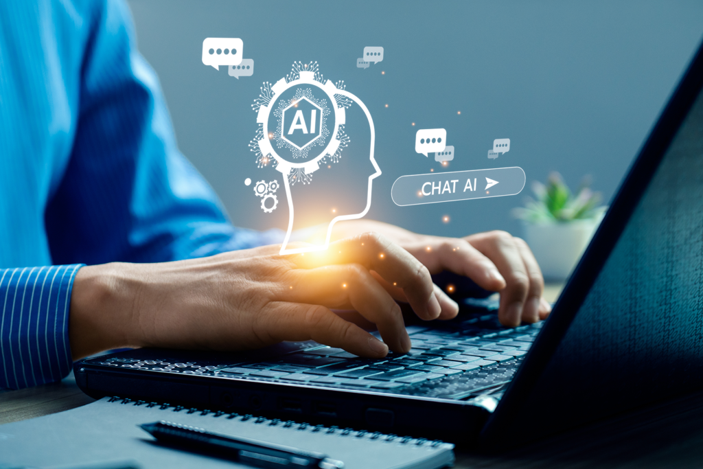 Mãos digitando em notebook com ícones de inteligência artificial e chat flutuando